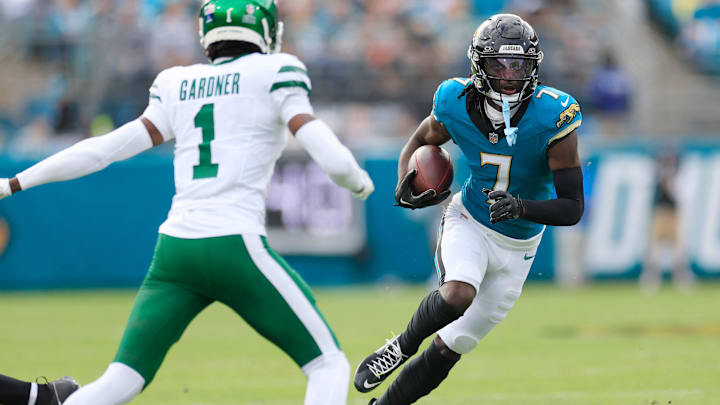 Jacksonville Jaguars wide receiver Brian Thomas Jr. (7) rushes for yards against New York Jets cornerback Sauce Gardner (1) during the first quarter Sunday, Dec. 15, 2024 at EverBank Stadium in Jacksonville, Fla. [Corey Perrine/Florida Times-Union]