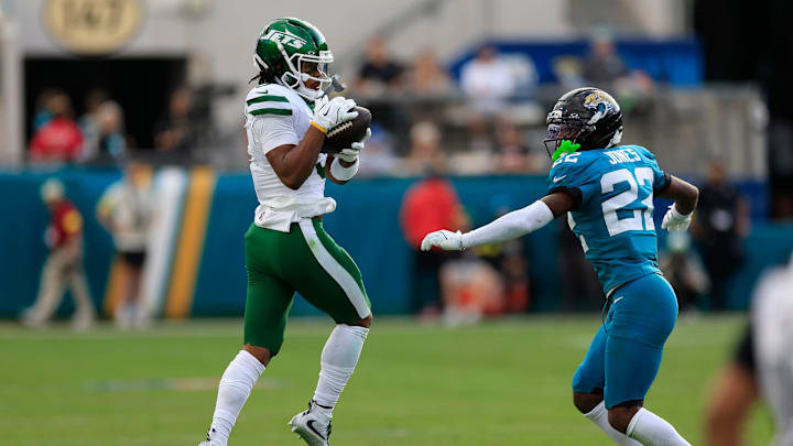 New York Jets wide receiver John Metchie III (3) catches a pass as Jacksonville Jaguars cornerback Jourdan Lewis (2) looks on during the fourth quarter of an NFL football matchup at EverBank Stadium, Sunday, Dec. 14, 2025, in Jacksonville, Fla. The Jaguars defeated the Jets 48-20. [Corey Perrine/Florida Times-Union]