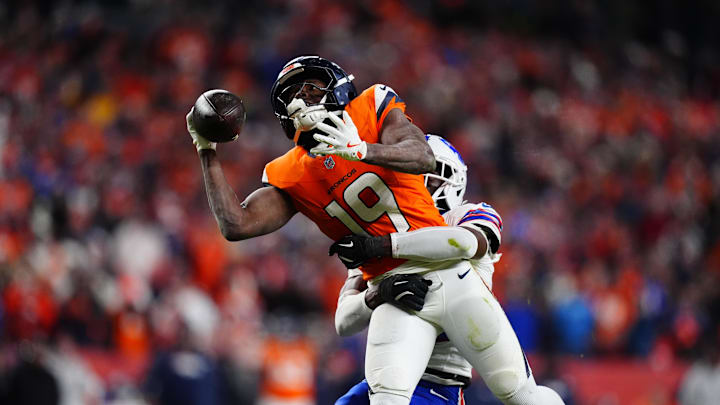Jan 17, 2026; Denver, CO, USA; Buffalo Bills cornerback Tre'davious White (27) is called for a pass interference on Denver Broncos wide receiver Marvin Mims Jr. (19) during overtime of an AFC Divisional Round playoff game at Empower Field at Mile High. Mandatory Credit: Ron Chenoy-Imagn Images