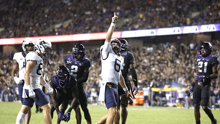 Sep 30, 2023; Fort Worth, Texas, USA; West Virginia Mountaineers quarterback Garrett Greene (6) reacts after scoring a touchdown against the TCU Horned Frogs in the third quarter at Amon G. Carter Stadium. Mandatory Credit: Tim Heitman-Imagn Images