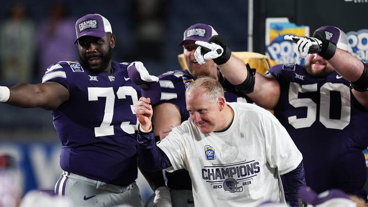 Dec 28, 2023; Orlando, FL, USA; Kansas State Wildcats head coach Chris Klieman celebrates after beating the North Carolina State Wolfpack in the Pop-Tarts bowl at Camping World Stadium. Mandatory Credit: Nathan Ray Seebeck-USA TODAY Sports Dec 28, 2023; Orlando, FL, USA; Kansas State Wildcats head coach Chris Klieman celebrates after beating the North Carolina State Wolfpack in the Pop-Tarts bowl at Camping World Stadium. Mandatory Credit: Nathan Ray Seebeck-USA TODAY Sports