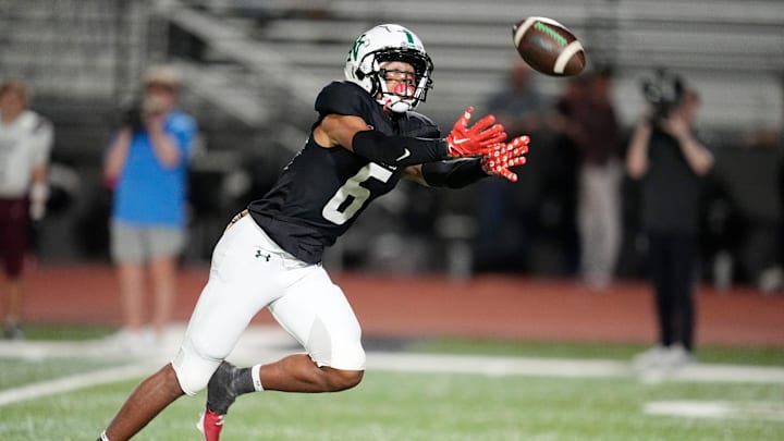 Norman North's Mason James can not make a reception during the high school football game between Norman North and Edmond Memorial at Norman High School in Norman, Okla., Thursday, Sept., 26, 2024.