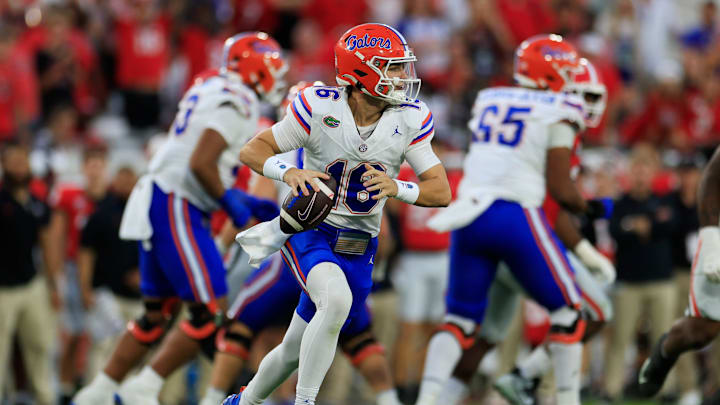 Florida Gators quarterback Aidan Warner (16) rolls from the pocket during the third quarter of an NCAA college football matchup Saturday, Nov. 2, 2024 at EverBank Stadium in Jacksonville, Fla. The Georgia Bulldogs defeated the Florida Gators 34-20. [Corey Perrine/Florida Times-Union]