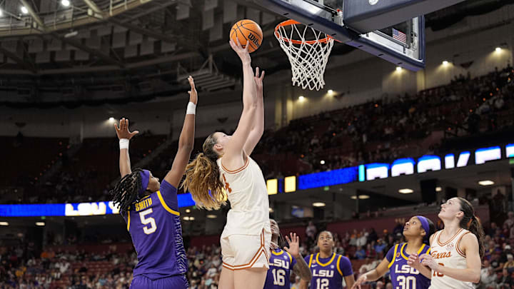 Mar 8, 2025; Greenville, SC, USA; Texas Longhorns forward Taylor Jones (44) goes to the basket against LSU Lady Tigers forward Sa'Myah Smith (5) during the second half at Bon Secours Wellness Arena. Mandatory Credit: Jim Dedmon-Imagn Images