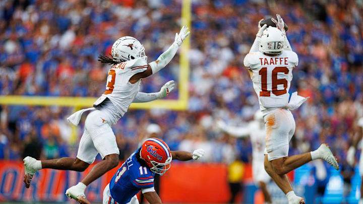 Oct 4, 2025; Gainesville, Florida, USA; Texas Longhorns defensive back Michael Taaffe (16) intercepts a pass to Florida Gators wide receiver Aidan Mizell (11) during the second half at Ben Hill Griffin Stadium. Mandatory Credit: Matt Pendleton-Imagn Images Oct 4, 2025; Gainesville, Florida, USA; Texas Longhorns defensive back Michael Taaffe (16) intercepts a pass to Florida Gators wide receiver Aidan Mizell (11) during the second half at Ben Hill Griffin Stadium. Mandatory Credit: Matt Pendleton-Imagn Images
