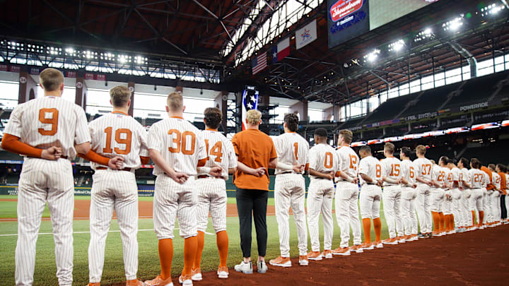 Feb 19, 2023; Arlington, TX, USA; Texas Longhorns listen to the National Anthem during a game against the Vanderbilt Commodores at Globe Life Field. Mandatory Credit: Dustin Safranek-Imagn Images