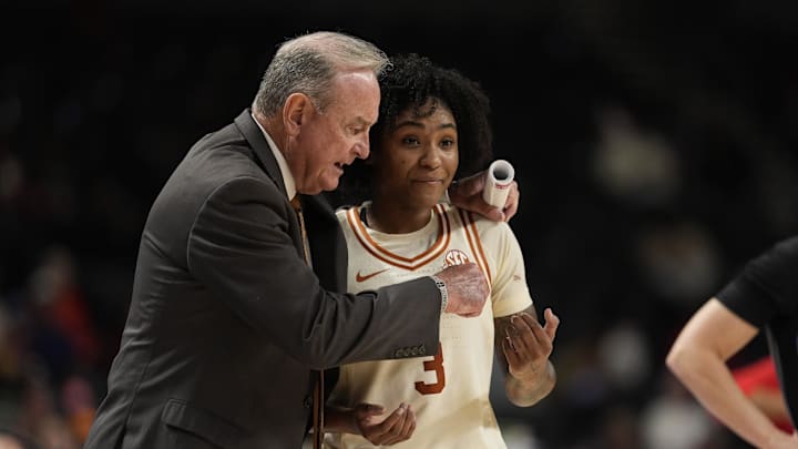 Texas Longhorns head coach Vic Schaefer talks with guard Rori Harmon during the second half against the Mississippi Rebels at Bon Secours Wellness Arena.