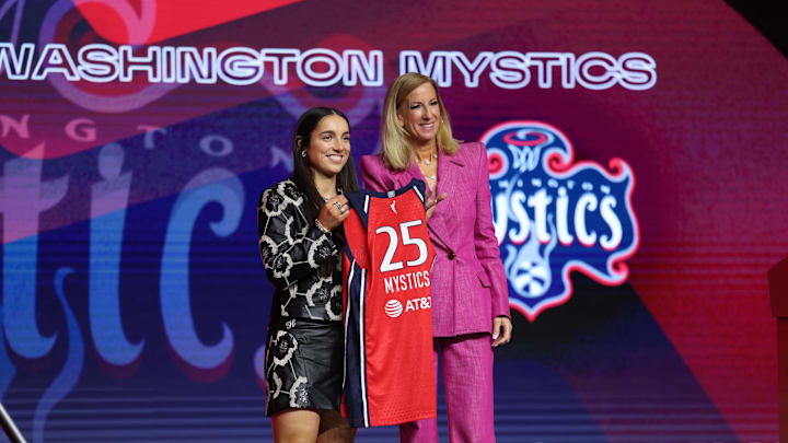 Apr 14, 2025; New York, New York, USA; Georgia Amoore poses with WNBA commissioner Cathy Engelbert after being selected with the number six overall pick to the Washington Mystics in the 2025 WNBA Draft at The Shed at Hudson Yards. Mandatory Credit: Vincent Carchietta-Imagn Images 