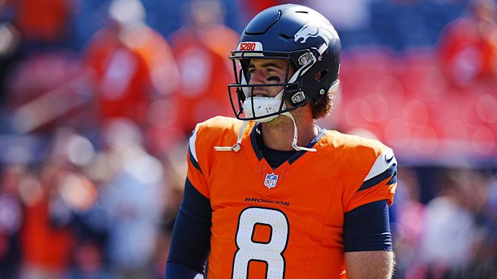 Oct 13, 2024; Denver, Colorado, USA; Denver Broncos quarterback Jarrett Stidham (8) warms up before the game against the Los Angeles Chargers at Empower Field at Mile High. 