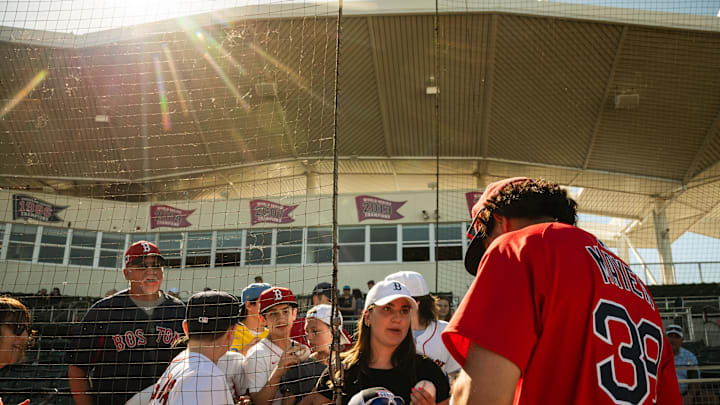 Red Sox prospect Marcelo Mayer signs autographs following a Spring Training game at JetBlue Park on March 11, 2025.