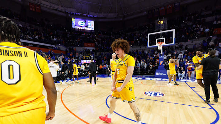 Jan 14, 2025; Gainesville, Florida, USA; Missouri Tigers guard T.O. Barrett (5) celebrates a win with Missouri Tigers guard Anthony Robinson II (0) after a game against the Florida Gators at Exactech Arena at the Stephen C. O'Connell Center. Mandatory Credit: Matt Pendleton-Imagn Images