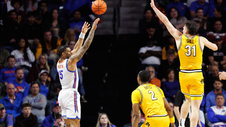 Jan 14, 2025; Gainesville, Florida, USA; Florida Gators guard Alijah Martin (15) attempts a three-point basket over Missouri Tigers guard Caleb Grill (31) during the first half at Exactech Arena at the Stephen C. O'Connell Center. Mandatory Credit: Matt Pendleton-Imagn Images Jan 14, 2025; Gainesville, Florida, USA; Florida Gators guard Alijah Martin (15) attempts a three-point basket over Missouri Tigers guard Caleb Grill (31) during the first half at Exactech Arena at the Stephen C. O'Connell Center. Mandatory Credit: Matt Pendleton-Imagn Images