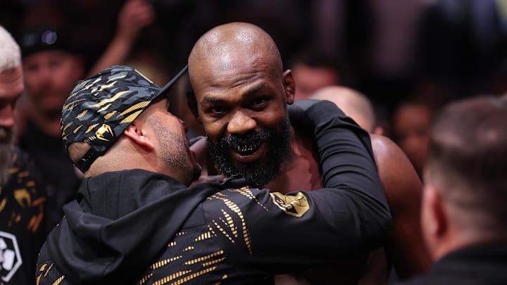 Nov 16, 2024; New York, NY, USA; Jon Jones (red gloves) enters prior to fighting Stipe Miocoic (blue gloves) in the  heavyweight bout during UFC 309 at Madison Square Garden. Mandatory Credit: Brad Penner-Imagn Images