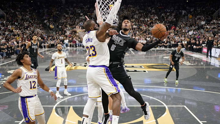 Nov 15, 2024; San Antonio, Texas, USA; San Antonio Spurs guard Stephon Castle (5) shoots over Los Angeles Lakers forward LeBron James (23) during the second half at Frost Bank Center. Mandatory Credit: Scott Wachter-Imagn Images