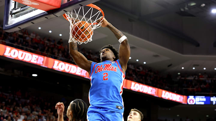 Feb 28, 2026; Auburn, Alabama, USA; Mississippi Rebels guard AJ Storr (2) makes a slam dunk against the Auburn Tigers during the first half at Neville Arena.