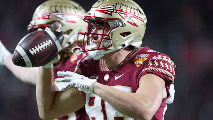 Dec 29, 2022; Orlando, Florida, USA; Florida State Seminoles tight end Brian Courtney (86) reacts after making a two point conversion against the Oklahoma Sooners in the second quarter during  the 2022 Cheez-It Bowl at Camping World Stadium. Mandatory Credit: Nathan Ray Seebeck-Imagn Images