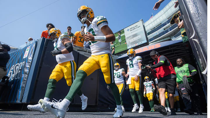 Green Bay Packers quarterback Jordan Love (10) runs onto the field before their game against the Chicago Bears last season