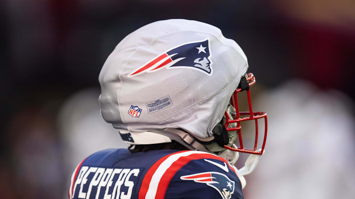 Dec 15, 2024; Glendale, Arizona, USA; Detailed view of the guardian cap on the helmet of New England Patriots safety Jabrill Peppers (5) against the Arizona Cardinals at State Farm Stadium. Mandatory Credit: Mark J. Rebilas-Imagn Images