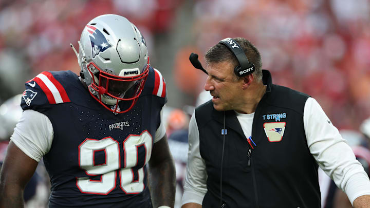 Nov 9, 2025; Tampa, Florida, USA; New England Patriots defensive tackle Christian Barmore (90) talks with head coach Mike Vrabel during the third quarter against the Tampa Bay Buccaneers at Raymond James Stadium. Mandatory Credit: Nathan Ray Seebeck-Imagn Images