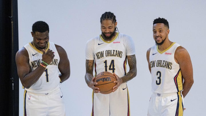 Oct 2, 2023; New Orleans, LA, USA; New Orleans Pelicans forward Zion Williamson (1), forward Brandon Ingram (14), and guard CJ McCollum (3) giggle as they pose during Pelicans media day at the Smoothie King Center. 