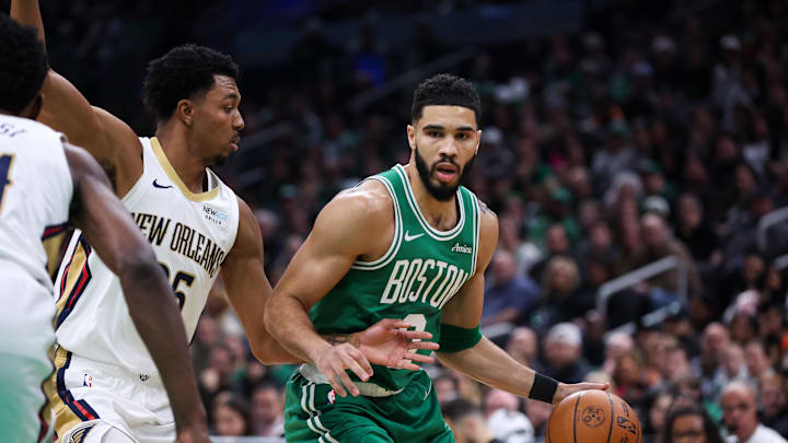 Jan 12, 2025; Boston, Massachusetts, USA; Boston Celtics forward Jayson Tatum (0) looks to pass during the first half against the New Orleans Pelicans at TD Garden. Mandatory Credit: Paul Rutherford-Imagn Images