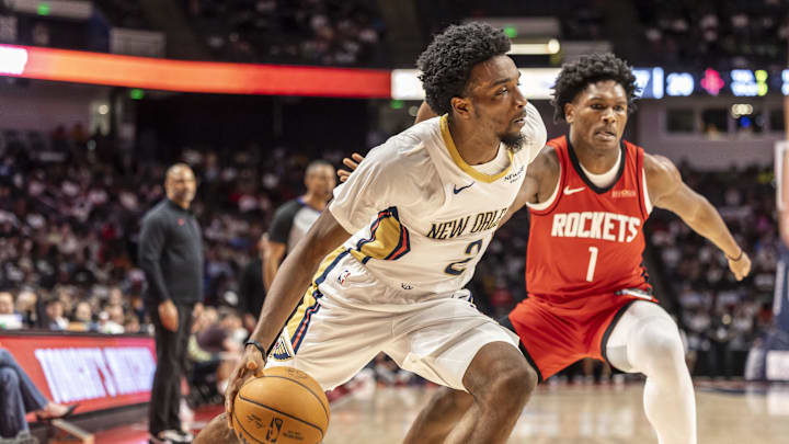 Oct 14, 2025; Birmingham, Alabama, USA; New Orleans Pelicans forward Herb Jones (2) works past Houston Rockets guard-forward Amen Thompson (1) during an NBA preseason game at Legacy Arena at BJCC. Mandatory Credit: Vasha Hunt-Imagn Images Oct 14, 2025; Birmingham, Alabama, USA; New Orleans Pelicans forward Herb Jones (2) works past Houston Rockets guard-forward Amen Thompson (1) during an NBA preseason game at Legacy Arena at BJCC. Mandatory Credit: Vasha Hunt-Imagn Images