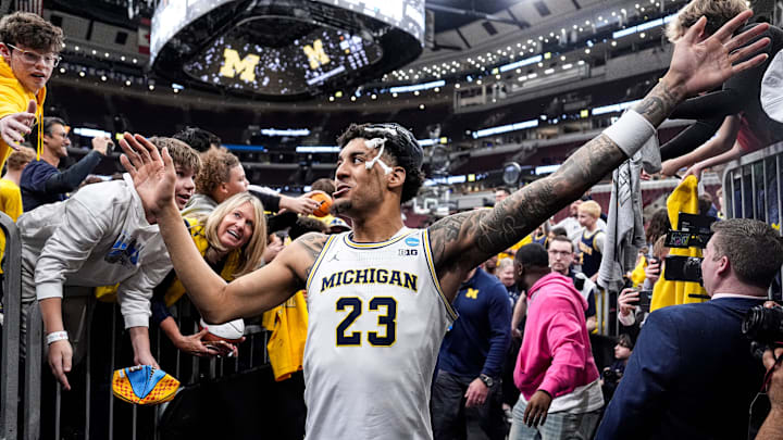Michigan forward Yaxel Lendeborg high-five fans as he exits the court after winning the NCAA Tournament Midwest Regional Championship by 95-62 win over Tennessee at United Center in Chicago on Sunday, March 29, 2026. Michigan forward Yaxel Lendeborg high-five fans as he exits the court after winning the NCAA Tournament Midwest Regional Championship by 95-62 win over Tennessee at United Center in Chicago on Sunday, March 29, 2026.