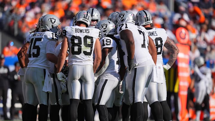 Oct 6, 2024; Denver, Colorado, USA; Members of the Las Vegas Raiders offensive squad huddles in the second half against the Denver Broncos at Empower Field at Mile High. Mandatory Credit: Ron Chenoy-Imagn Images