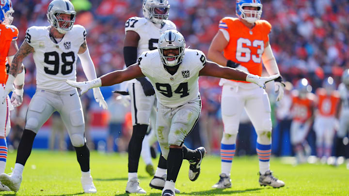 Oct 6, 2024; Denver, Colorado, USA; Las Vegas Raiders defensive tackle Christian Wilkins (94) celebrates his sack in the second quarter against the Denver Broncos at Empower Field at Mile High. Mandatory Credit: Ron Chenoy-Imagn Images