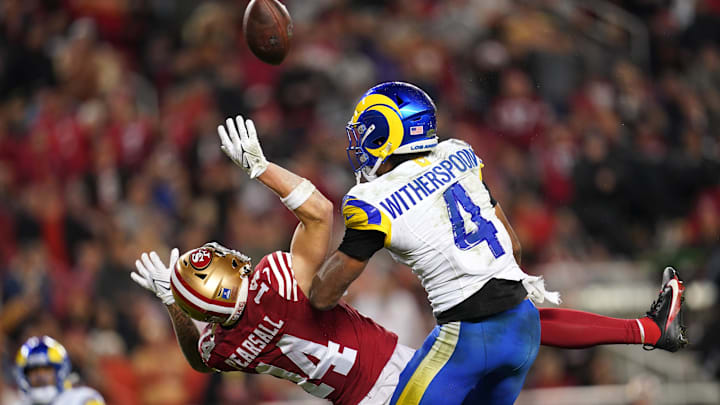 Dec 12, 2024; Santa Clara, California, USA; Los Angeles Rams cornerback Ahkello Witherspoon (4) breaks up a pass intended for San Francisco 49ers wide receiver Ricky Pearsall (14) in the fourth quarter at Levi's Stadium. Mandatory Credit: Cary Edmondson-Imagn Images