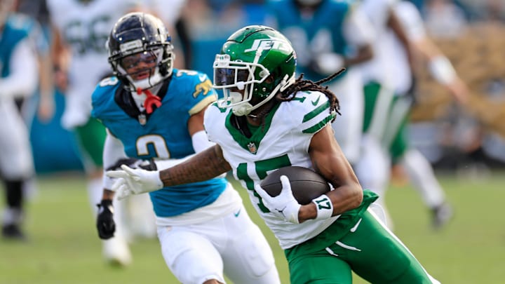 New York Jets wide receiver Davante Adams (17) rushes for yards against Jacksonville Jaguars cornerback Tyson Campbell (3) during the third quarter Sunday, Dec. 15, 2024 at EverBank Stadium in Jacksonville, Fla. The Jets held off the Jaguars 32-25. [Corey Perrine/Florida Times-Union]
