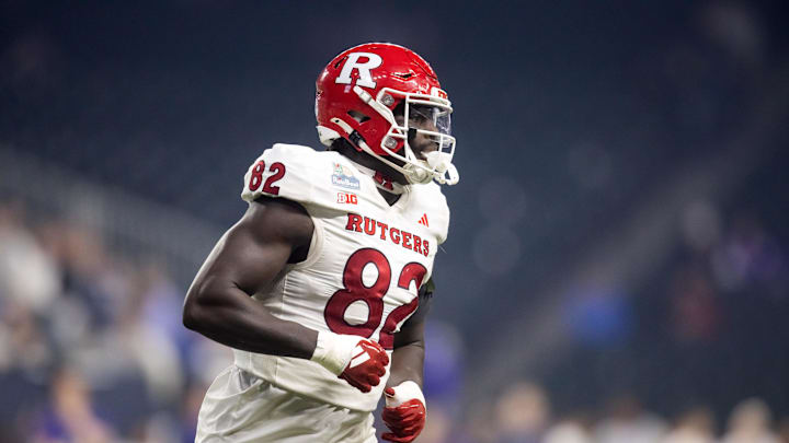 Dec 26, 2024; Phoenix, AZ, USA; Rutgers Scarlet Knights defensive lineman Jordan Walker (82) against the Kansas State Wildcats during the Rate Bowl at Chase Field. Mandatory Credit: Mark J. Rebilas-Imagn Images