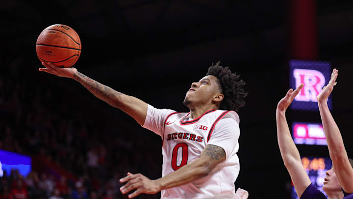Jan 11, 2026; Piscataway, New Jersey, USA; Rutgers Scarlet Knights guard Tariq Francis (0) goes to the basket against the Northwestern Wildcats during overtime at Jersey Mike's Arena. Mandatory Credit: Vincent Carchietta-Imagn Images