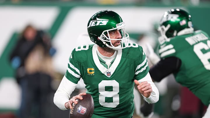 Jan 5, 2025; East Rutherford, New Jersey, USA; New York Jets quarterback Aaron Rodgers (8) rolls out during the first half against the Miami Dolphins at MetLife Stadium. Mandatory Credit: Vincent Carchietta-Imagn Images Jan 5, 2025; East Rutherford, New Jersey, USA; New York Jets quarterback Aaron Rodgers (8) rolls out during the first half against the Miami Dolphins at MetLife Stadium. Mandatory Credit: Vincent Carchietta-Imagn Images