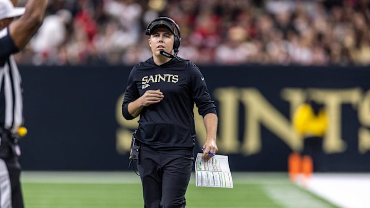 Sep 14, 2025; New Orleans, Louisiana, USA;  New Orleans Saints head coach Kellen Moore looks on against the San Francisco 49ers during the first half at Caesars Superdome. Mandatory Credit: Stephen Lew-Imagn Images
