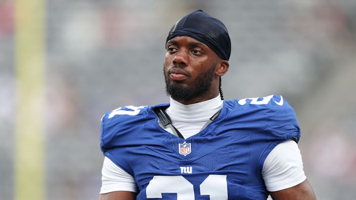Aug 16, 2025; East Rutherford, New Jersey, USA; New York Giants cornerback Paulson Adebo (21) looks on ptpg against the New York Jets at MetLife Stadium. Mandatory Credit: Vincent Carchietta-Imagn Images