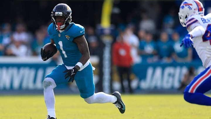 Jacksonville Jaguars running back Travis Etienne Jr. (1) rushes for yards during the third quarter of an NFL football AFC Wild Card playoff matchup, Sunday, Jan. 11, 2026, in Jacksonville, Fla. The Bills defeated the Jaguars 27-24. [Corey Perrine/Florida Times-Union]