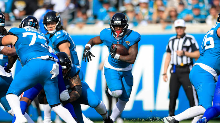 Jacksonville Jaguars running back Travis Etienne Jr. (1) rushes for yards during the first quarter of an NFL football AFC Wild Card playoff matchup, Sunday, Jan. 11, 2026, in Jacksonville, Fla. The Bills defeated the Jaguars 27-24. [Corey Perrine/Florida Times-Union]