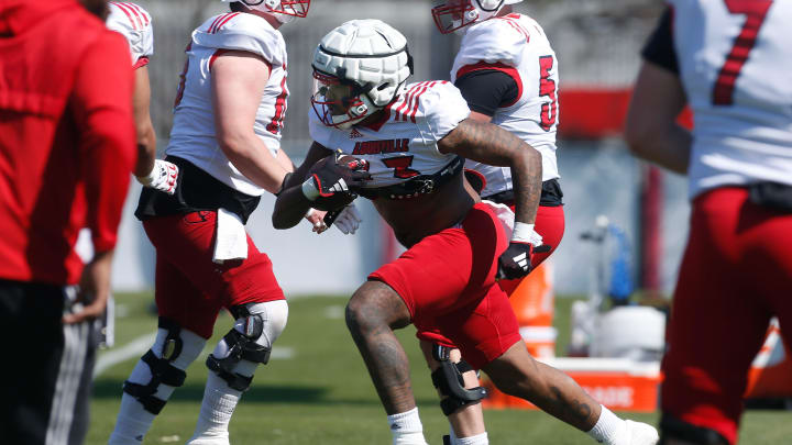 Louisville’s Peny Boone ran the ball during spring practice Friday afternoon, Mar. 29, 2024