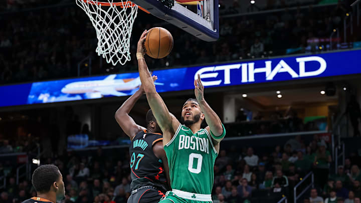 Mar 17, 2024; Washington, District of Columbia, USA; Boston Celtics forward Jayson Tatum (0) goes to the basket vs. the Washington Wizards.