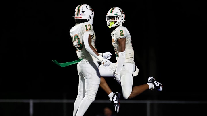 Mandarin's Jaime Ffrench Jr. (2) celebrates his touchdown score with Aquaryus Glover (13) during the