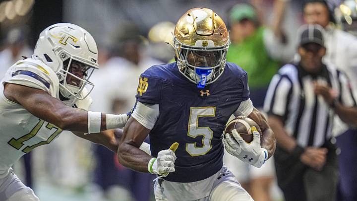 Oct 19, 2024; Atlanta, Georgia, USA; Notre Dame Fighting wide receiver Beaux Collins (5) runs against Georgia Tech Yellow Jackets linebacker Jackson Hamilton (17) during the first half at Mercedes-Benz Stadium. Mandatory Credit: Dale Zanine-Imagn Images Oct 19, 2024; Atlanta, Georgia, USA; Notre Dame Fighting wide receiver Beaux Collins (5) runs against Georgia Tech Yellow Jackets linebacker Jackson Hamilton (17) during the first half at Mercedes-Benz Stadium. Mandatory Credit: Dale Zanine-Imagn Images