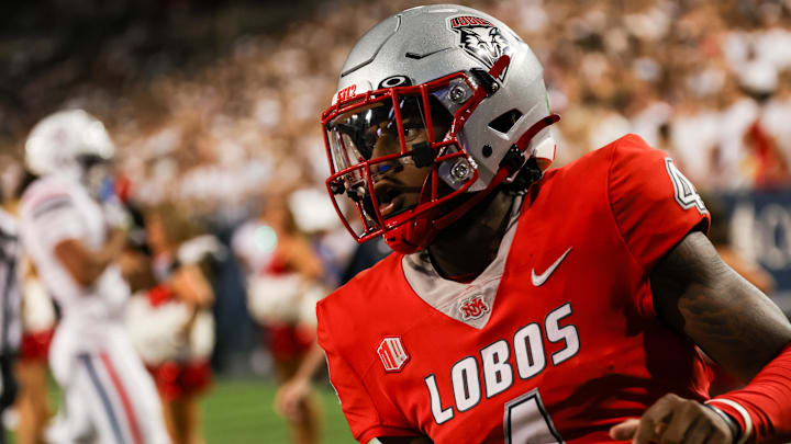 Aug 31, 2024; Tucson, Arizona, USA; New Mexico quarterback Devon Dampier (4) runs during third quarter at Arizona Stadium. Mandatory Credit: Aryanna Frank-Imagn Images