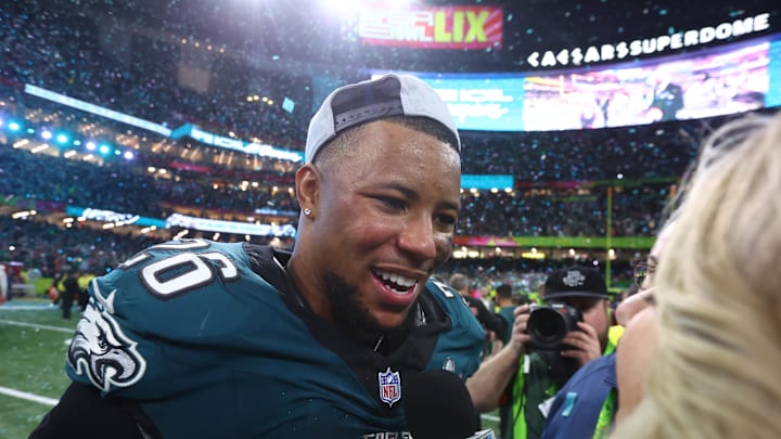 Philadelphia Eagles running back Saquon Barkley (26) is interviewed on field after defeating the Kansas City Chiefs in Super Bowl LIX.