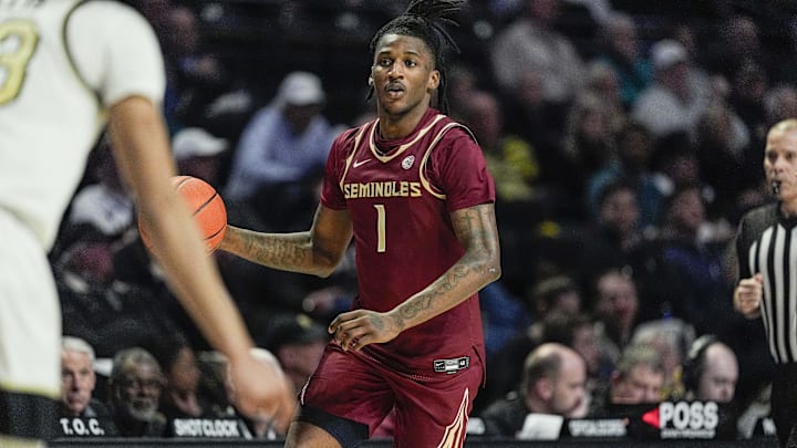 Feb 12, 2025; Winston-Salem, North Carolina, USA;  Florida State Seminoles guard Jamir Watkins (1) brings the ball up court against the Wake Forest Demon Deacons during the second half at Lawrence Joel Veterans Memorial Coliseum. Mandatory Credit: Jim Dedmon-Imagn Images