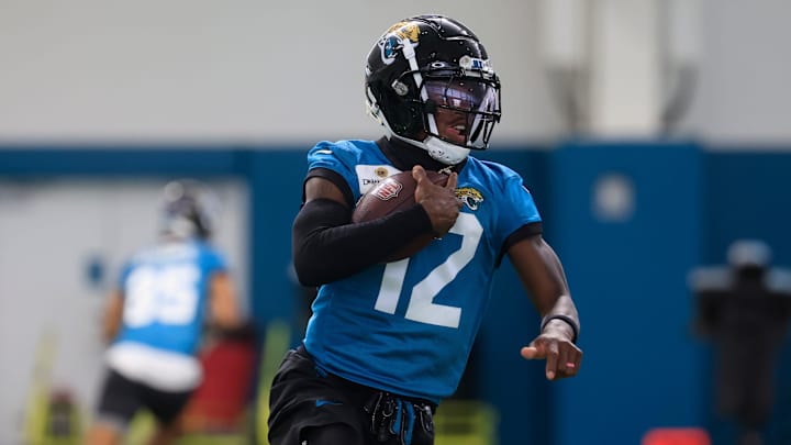 Jacksonville Jaguars wide receiver Travis Hunter runs the ball during OTAs.