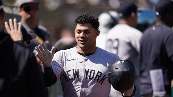 Sep 22, 2024; Oakland, California, USA; New York Yankees left fielder Jasson Dominguez (89) is congratulated by teammates after hitting a two-run home run against the Oakland Athletics in the second inning at the Oakland-Alameda County Coliseum. Mandatory Credit: Cary Edmondson-Imagn Images