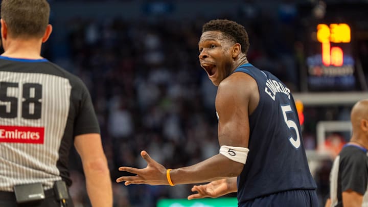 Apr 27, 2025; Minneapolis, Minnesota, USA; Minnesota Timberwolves guard Anthony Edwards (5) argues with referee Josh Tiven (58) after a foul against the Los Angeles Lakers bench in the second quarter during game four of first round for the 2025 NBA Playoffs at Target Center. Mandatory Credit: Matt Blewett-Imagn Images