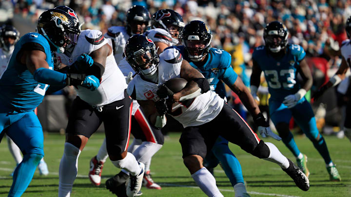 Houston Texans running back Joe Mixon (28) scores a touchdown during the third quarter of an NFL football matchup Sunday, Dec. 1, 2024 at EverBank Stadium in Jacksonville, Fla. The Texans held off the Jaguars 23-20. [Corey Perrine/Florida Times-Union]