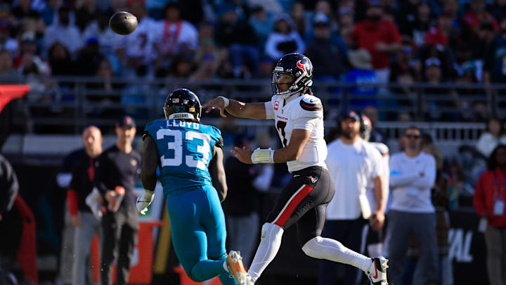 Houston Texans quarterback C.J. Stroud (7) throws the ball against Jacksonville Jaguars linebacker Devin Lloyd (33) during the third quarter of an NFL football matchup Sunday, Dec. 1, 2024 at EverBank Stadium in Jacksonville, Fla. The Texans held off the Jaguars 23-20. [Corey Perrine/Florida Times-Union]